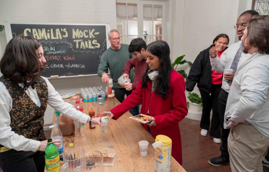 Milstein student Camila Orr '24 serves custom Mocktails to Salon students and guests.