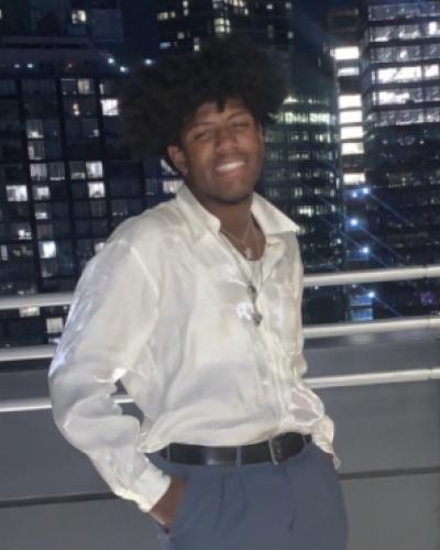 Seth Stephenson Portrait in front of city skyline at night