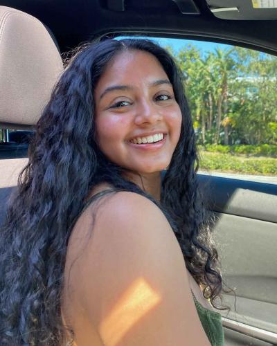 Milstein Program student profile picture of Neha Jain smiling